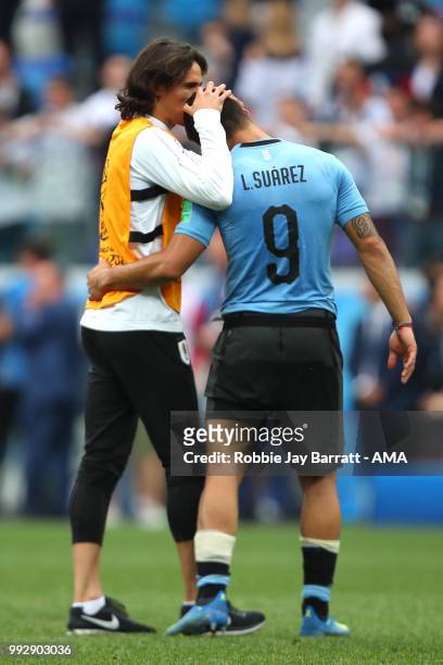 Luis Suarez of Uruguay lis consoled b Edison Cavani of Uruguay at the end of the 2018 FIFA World Cup Russia Quarter Final match between Uruguay and...