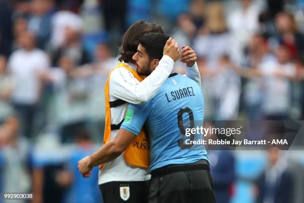 Luis Suarez of Uruguay lis consoled b Edison Cavani of Uruguay at the end of the 2018 FIFA World Cup Russia Quarter Final match between Uruguay and...