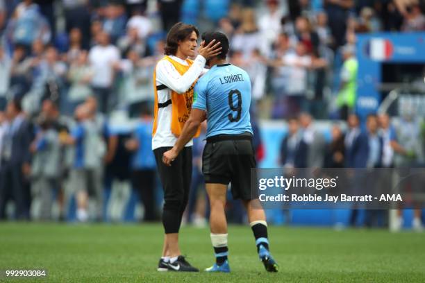 Luis Suarez of Uruguay lis consoled b Edison Cavani of Uruguay at the end of the 2018 FIFA World Cup Russia Quarter Final match between Uruguay and...