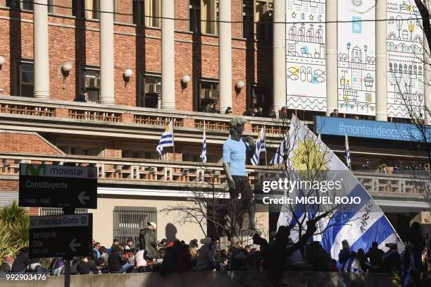 Fans of Uruguay attend the broadcasting of the Russia 2018 FIFA World Cup football match Uruguay against France on a big screen at City Hall...