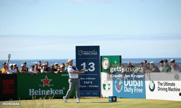 Jon Rahm of Spain tees off on the 13th hole during the second round of the Dubai Duty Free Irish Open at Ballyliffin Golf Club on July 6, 2018 in...