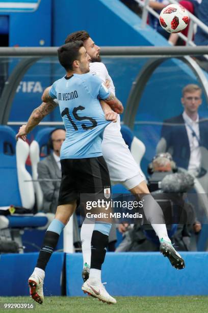 Matias Vecino of Uruguay national team and Olivier Giroud of France national team vie for the ball during the 2018 FIFA World Cup Russia Quarter...