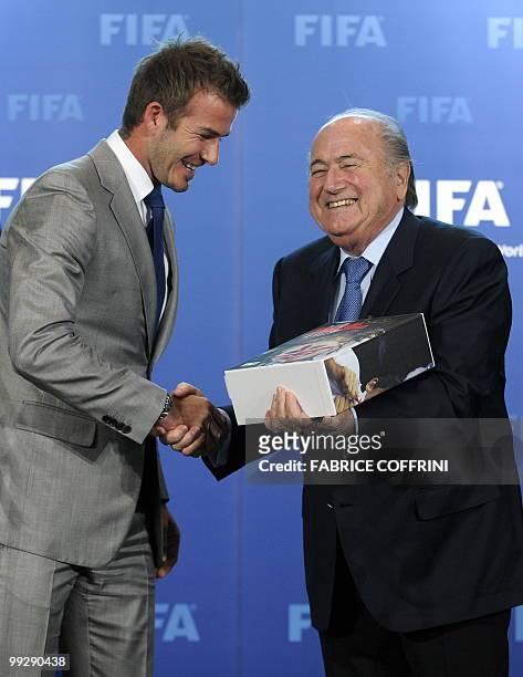 President Sepp Blatter shakes hands with former England football captain David Beckham after receiving the England 2018 and 2022 World Cup bid book...
