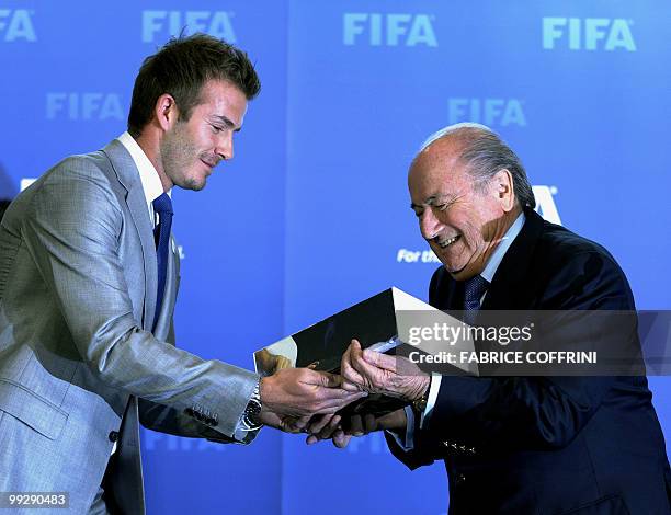 President Sepp Blatter receives from David Beckham the England 2018 and 2022 World Cup bid book during for an official handover ceremony at FIFA's...