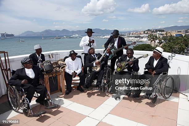 Congolese street musicians Staff Benda Bilili attend the 'Benda Bilili' Photocall at the Palais Stephanie during the 63rd Annual Cannes Film Festival...