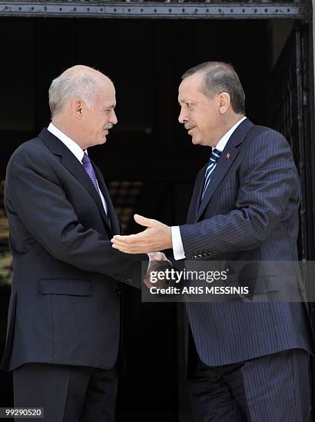 Greek Premier George Papandreou speaks with his Turkish counterpart Recep Tayyip Erdogan before their meeting in Athens on May 14, 2010. Turkey's...