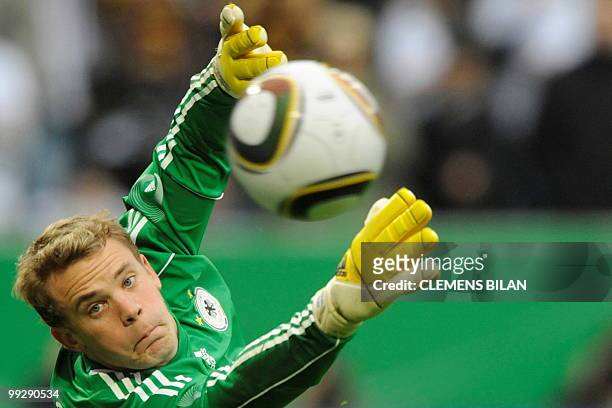 Germany's goalkeeper Manuel Neuer makes a save during the friendly football match Germany vs Malta in the western German city of Aachen on May 13,...