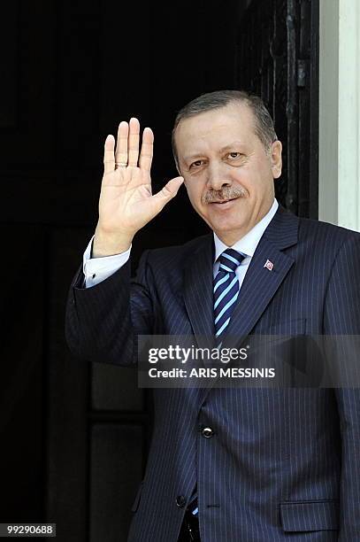 Turkish Prime Minister Recep Tayyip Erdogan waves before his meeting with the Greek Premier George Papandreou in Athens on May 14, 2010. Erdogan is...