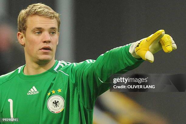 Germany's goalkeeper Manuel Neuer gestures during the friendly football match Germany vs Malta in the western German city of Aachen on May 13, 2010...