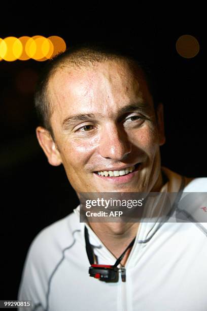 French skipper Bertrand Castelnerac smiles on his "BcomBIO" monohull upon his arrival at the end of the transat AG2R La Mondiale sailing race between...