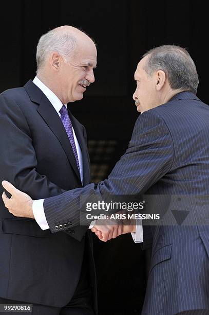 Greek Premier George Papandreou welcomes his Turkish counterpart Recep Tayyip Erdogan before their meeting in Athens on May 14, 2010. Erdogan is in...