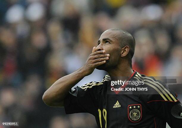 Germany's striker Cacau celebrates after scoring during the friendly football match Germany vs Malta in the western German city of Aachen on May 13,...