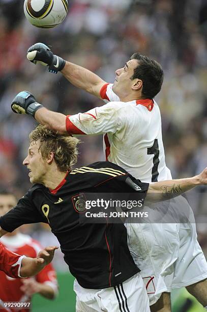 Germany's striker Stefan Kiessling and Malta's goalkeeper Justin Haber vie for the ball during the friendly football match Germany vs Malta in the...