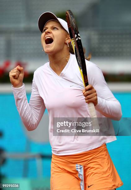 Lucie Safarova of the Czech Republic celebrates match point against Nadia Petrova of Russia in their quarter final match during the Mutua Madrilena...