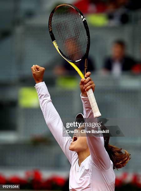 Lucie Safarova of the Czech Republic celebrates match point against Nadia Petrova of Russia in their quarter final match during the Mutua Madrilena...