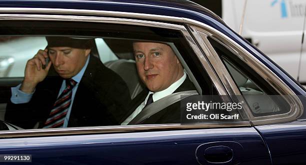 British Prime Minister David Cameron is stuck in traffic in his car following a visit to the Department for Energy and Climate Change on May 14, 2010...