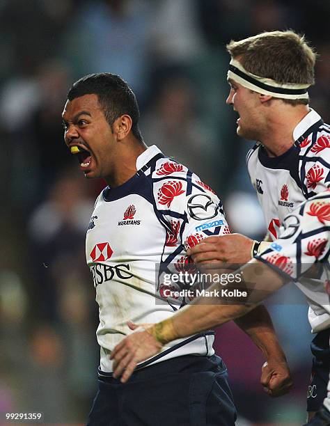 Kurtley Beale of the Waratahs celebrates scoring a try during the round 14 Super 14 match between the Waratahs and the Hurricanes at Sydney Football...