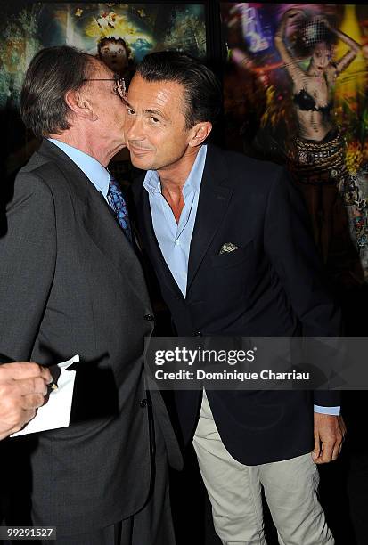 Pal Sarkozy and his son Francois Sarkozy pose during the opening of his exhibition. At Espace Pierre Cardin on April 24, 2010 in Paris, France.