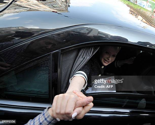 Yulia Tymoshenko shakes the hand of a supporter as she leaves the Prosecutor general�s office in Kiev on May 12, 2010. Ukrainian authorities have...