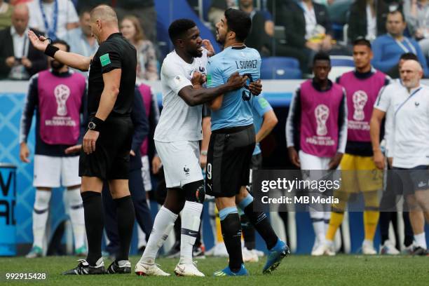 Samuel Umtiti of France national team calms down Luis Suarez of Uruguay national team during the 2018 FIFA World Cup Russia Quarter Final match...