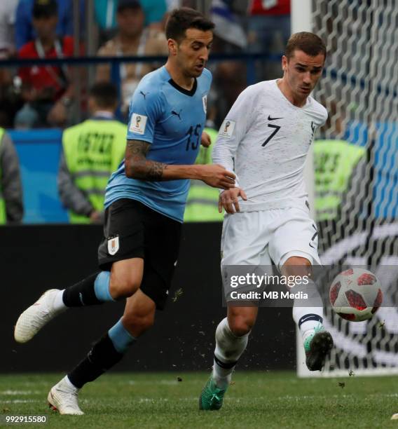 Matias Vecino of Uruguay national team and Antoine Griezmann of France national team vie for the ball during the 2018 FIFA World Cup Russia Quarter...