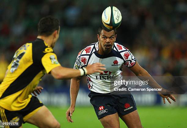 Kurtley Beale of the Waratahs chips the ball ahead during the round 14 Super 14 match between the Waratahs and the Hurricanes at Sydney Football...