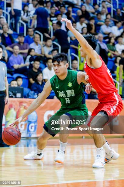 Lam Chun Kwong of Tycoon Basketball Team goes to the basket against the SCAA during the Hong Kong Basketball League playoff game between SCAA and...