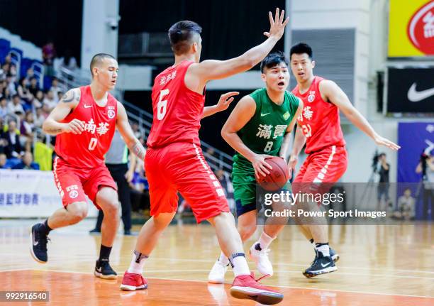Lam Chun Kwong of Tycoon Basketball Team handles the ball against the SCAA during the Hong Kong Basketball League playoff game between SCAA and...