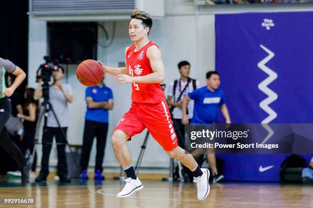 Lo Yi Ting of SCAA Men's Basketball Team dribbles the ball up court against the Tycoon during the Hong Kong Basketball League playoff game between...