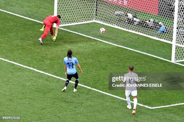 Uruguay's goalkeeper Fernando Muslera deflects the ball into his net during the Russia 2018 World Cup quarter-final football match between Uruguay...