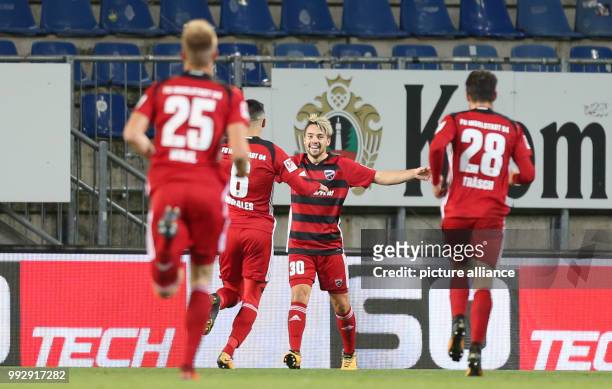 Goalscorer Thomas Pledl of Ingolstadt celebrates the goal for 0:1 with Hauke Wahl , Alfredo Morales and Christian Traesch during the German 2nd...
