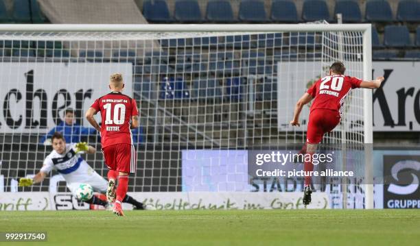 Bielefeld goalie Stefan Ortega has no chance to stop the penalty for 1:2 by Stefan Kutschke of Ingolstadt, while Ingolstadt's Sonny Kittel looks on,...