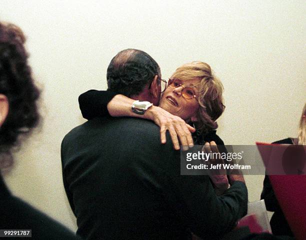 Actress Jane Fonda hugs John Conyers Jr., D-Mich., during a special Valentine's Day press conference along with congressional leaders to launch an...
