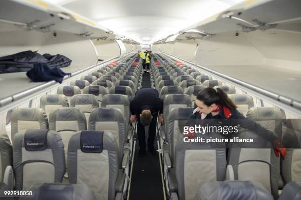 Air Berlin staff prepare the cabin of the Airbus A320 for the return flight after landing in Munich, Germany, 27 October 2017. Photo: Gregor...