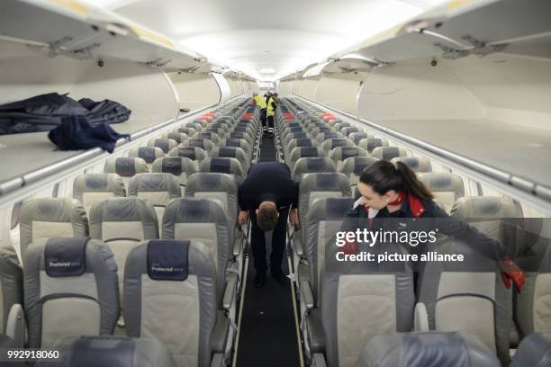 Dpatop - Air Berlin staff prepare the cabin of the Airbus A320 for the return flight after landing in Munich, Germany, 27 October 2017. Photo: Gregor...