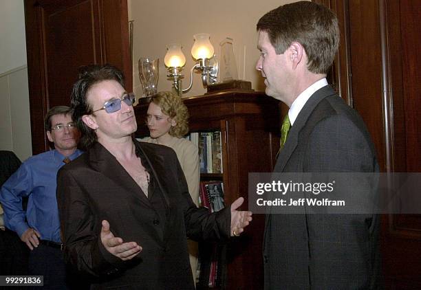 S lead singer Bono meets with Senator Bill Frist, R-TN, to gain congression support for AIDS funding.