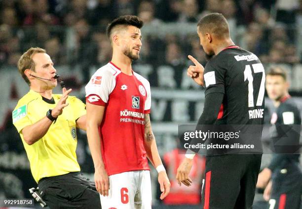 Mainz's Danny Latza and Frankfurt's Kevin-Prince Boateng have an argument during the German Bundesliga football match between FSV Mainz 05 and...