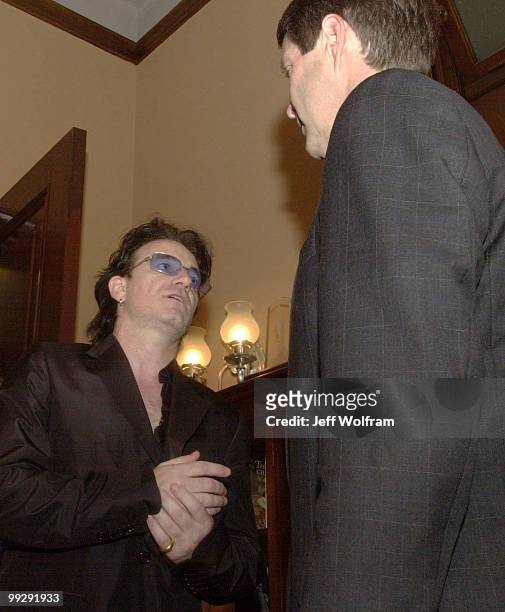 S lead singer Bono meets with Senator Bill Frist, R-TN, to gain congression support for AIDS funding.