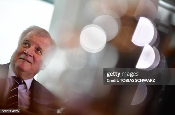 German Interior Minister Horst Seehofer awaits the start of the weekly cabinet meeting in Berlin on July 6, 2018.