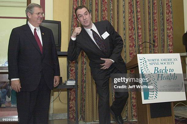 Spine specialist Joel Press of Chicago demonstrates exercises to prevent back injury during a lunchen put on by the North American Spine Society...