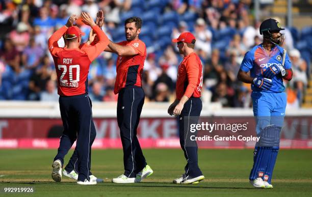 Liam Plunkett of England celebrates with Jason Roy after bowling Lokesh Rahul of India during the 2nd Vitality International T20 match between...