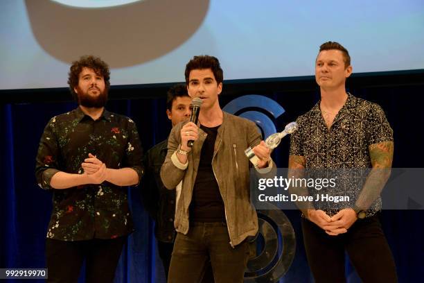 Jamie Morrison, Adam Zindani, Kelly Jones and Richard Jones of the Stereophonics, winners of the American Express Icon Award on stage during the...