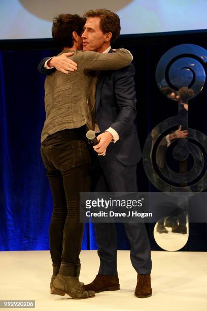 Kelly Jones and presenter Rob Brydon on stage during the Nordoff Robbins' O2 Silver Clef Awards ceremony at Grosvenor House, on July 6, 2018 in...