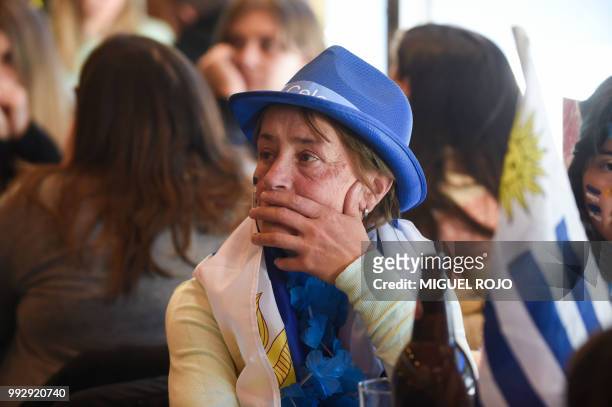 Fans of Uruguay attend the broadcasting of the Russia 2018 FIFA World Cup football match, Uruguay against France, at a bar in downtown Montevideo, on...