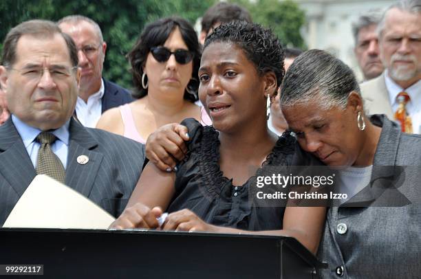 Mia Edwards a single mother of three with HIV address the crowd on the importance of housing for those who are HIV positive alongside Rep. Jerrold...