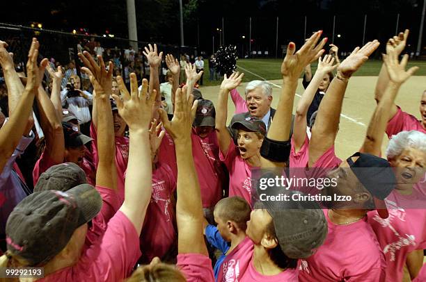 Members of the House and Senate congressional softball team do a team cheer to boost their spirits at Guy Mason Field on Tuesday Night. Tuesday, July...