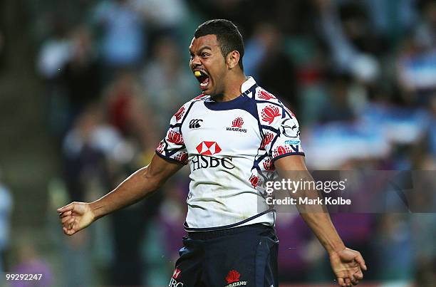 Kurtley Beale of the Waratahs celebrates scoring a try during the round 14 Super 14 match between the Waratahs and the Hurricanes at Sydney Football...