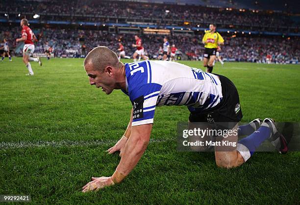 Luke Patten of the Bulldogs looks dejected after missing a tackle on Matt Cooper of the Dragons during the round 10 NRL match between the...