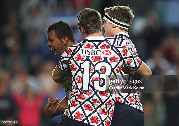 Kurtley Beale of the Waratahs celebrates scoring a try during the round 14 Super 14 match between the Waratahs and the Hurricanes at Sydney Football...