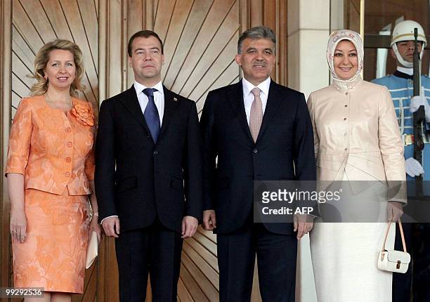 Turkey's President Abdullah Gul and his Russian counterpart Dmitry Medvedev pose with their spouses Hayrunnisa Gul and Svetlana Medvedeva during a...